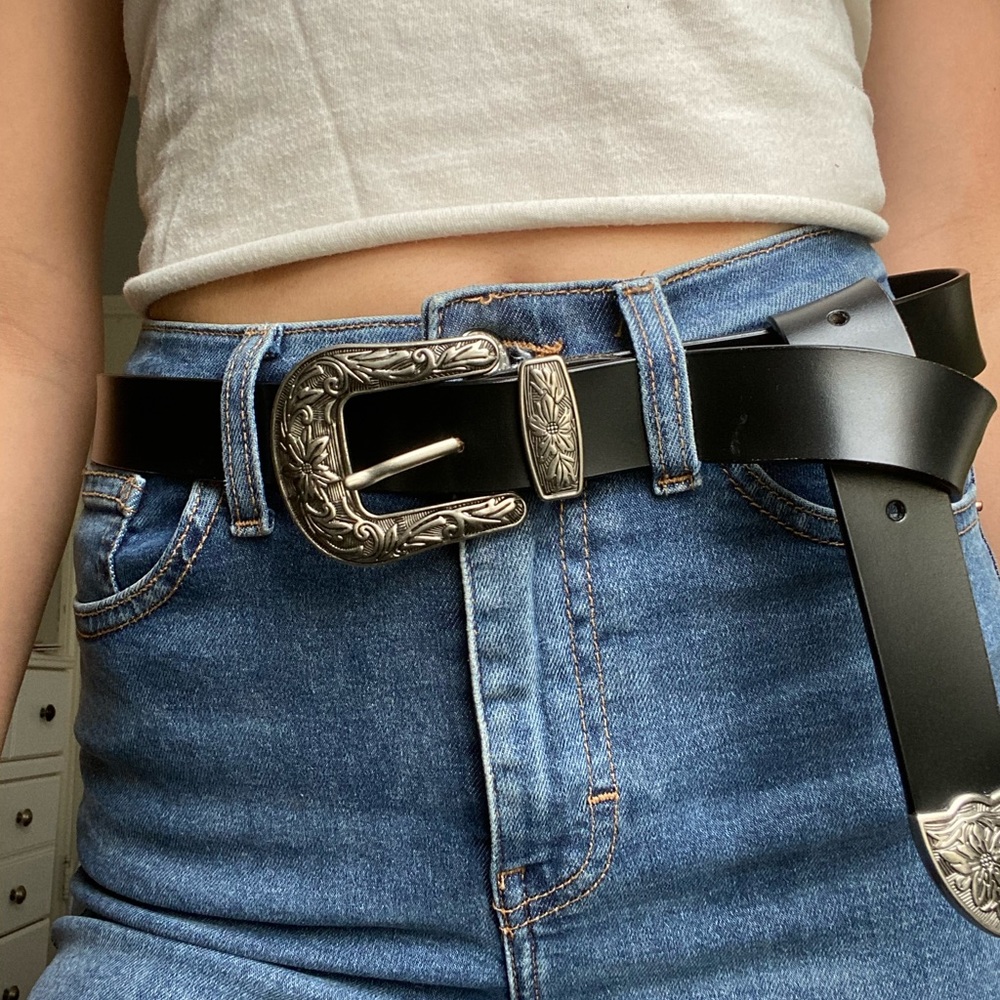 Black faux leather belt with silver buckle detail